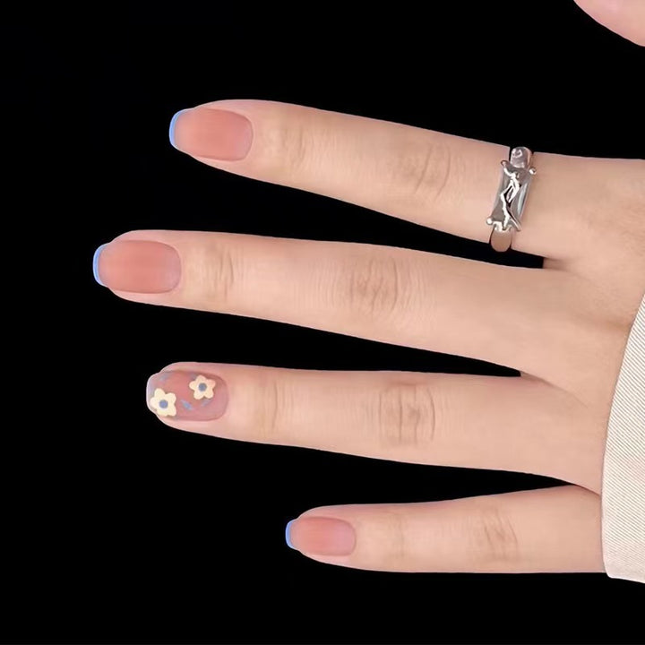 Creative nail design with floral accents Stornfield
