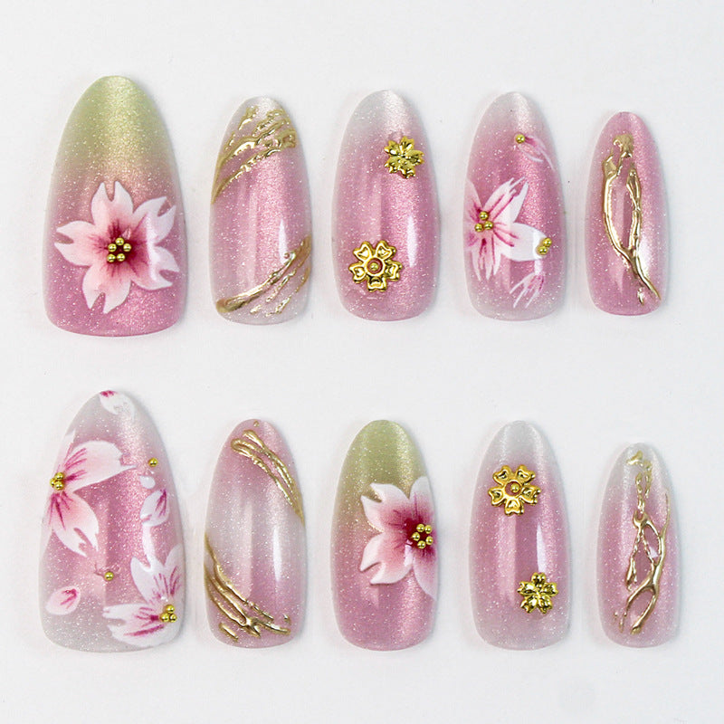 Artificial nails with floral design and gold accents Stornfield