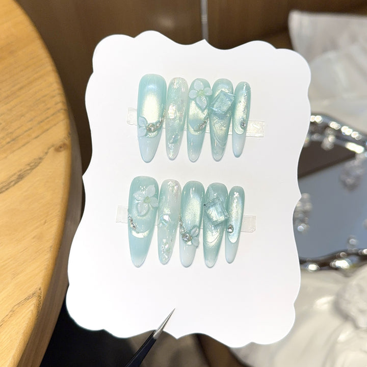 Artificial nails with floral designs and glitter effects Stornfield