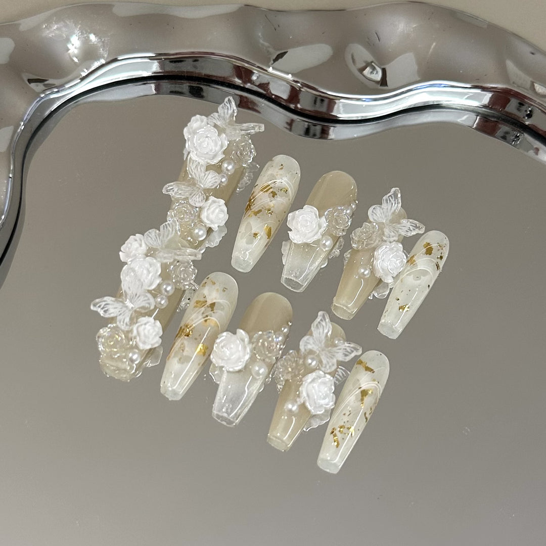 Elegant Press-On Nail Art Set with Floral and Pearl Accents
