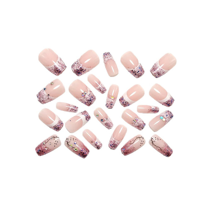 Glamorous artificial nails with glitter and rhinestone embellishments Stornfield