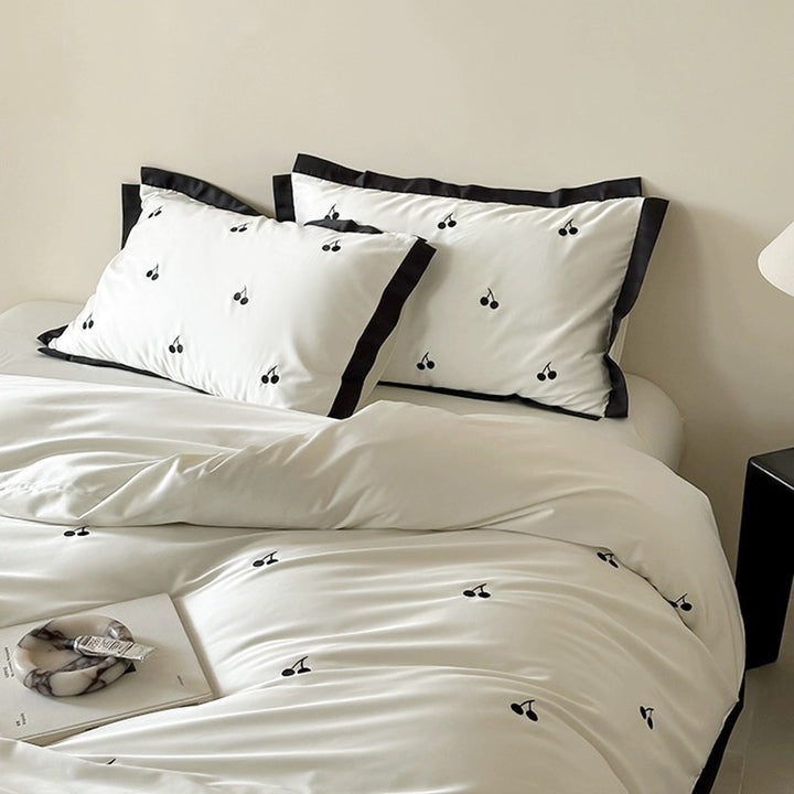 Luxurious satin bedding set with cherry embroidery and contrasting trim