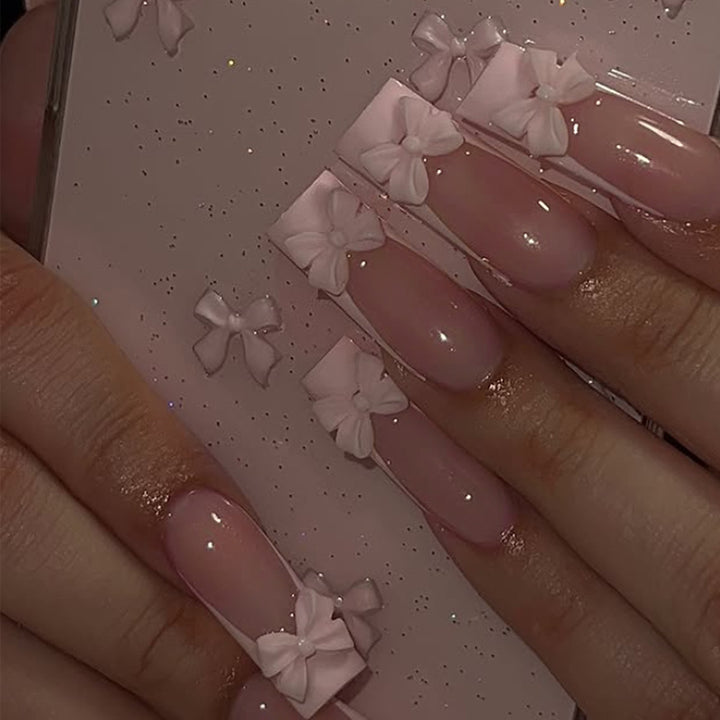 Artificial nail set with shimmering details and cute bows Stornfield