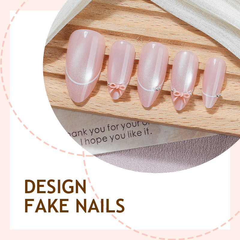 Artificial nail set with elegant bow and glitter accents Stornfield 1789119022