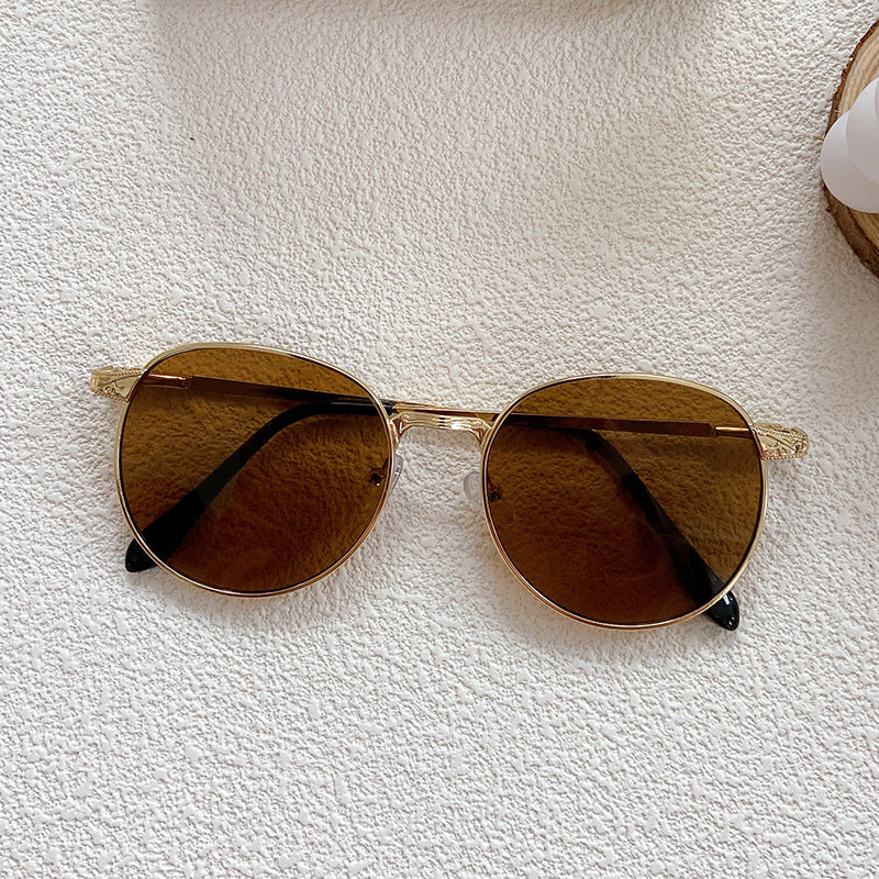 Fashionable sunglasses with round frame and intricate design Stornfield