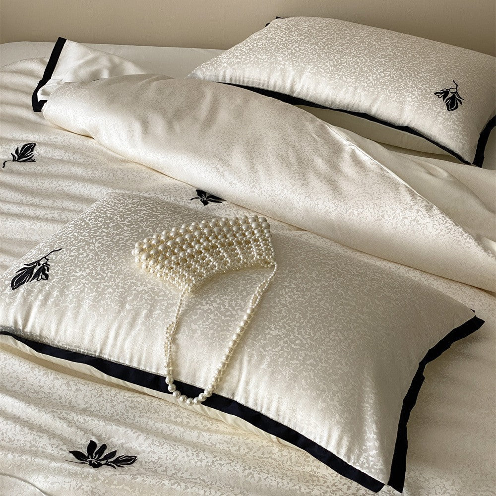 Reversible Jacquard Sateen Duvet Cover Set with Minimalist Botanical Embroidery and Contrast Piped Shams