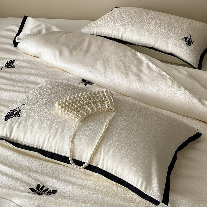 Reversible Jacquard Sateen Duvet Cover Set with Minimalist Botanical Embroidery and Contrast Piped Shams