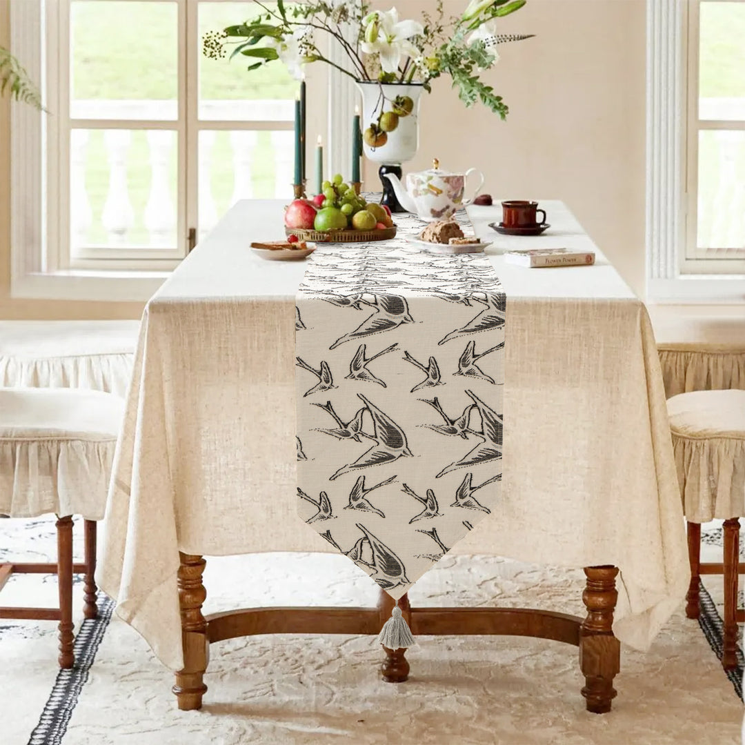Elegant linen table runner with tassels and decorative print