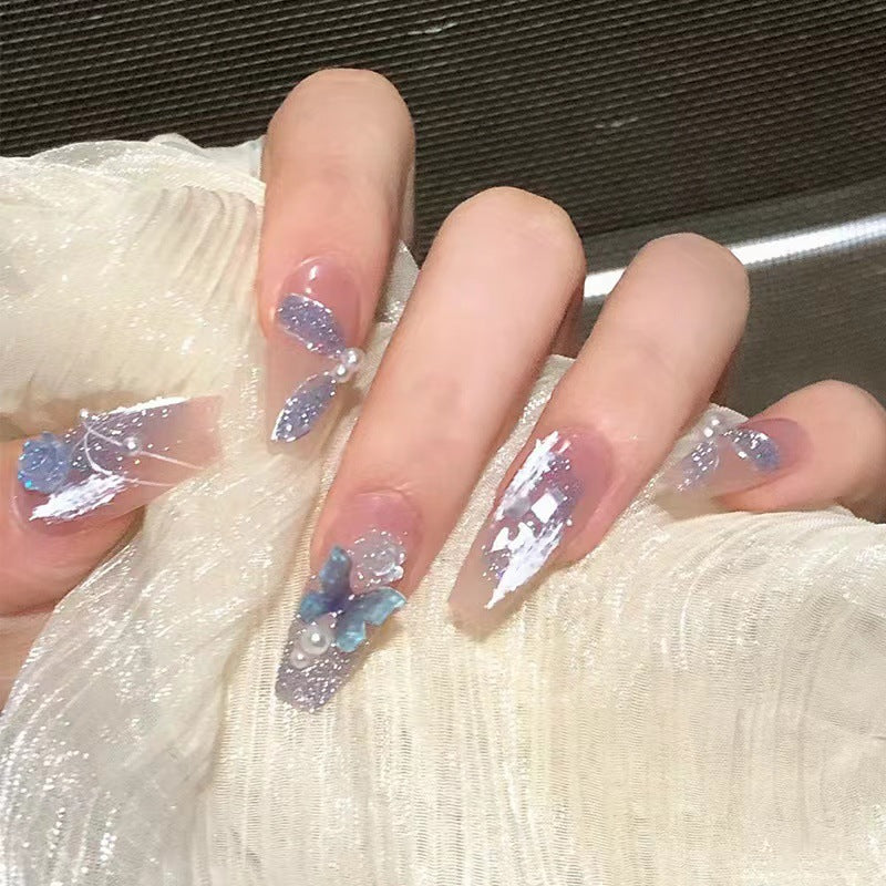 Artistic 3D nail extensions with glitter accents Stornfield