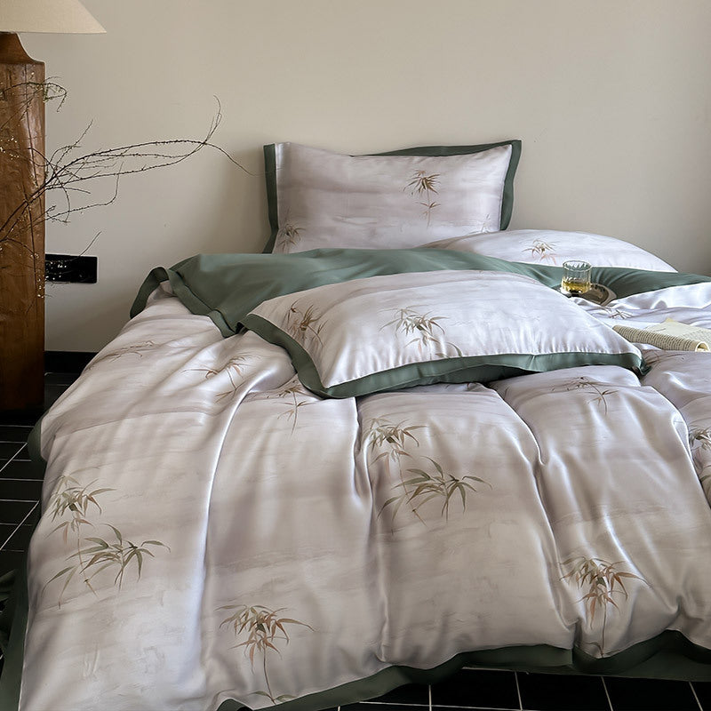 Luxurious satin bedding set with subtle bamboo print and contrasting decorative piping