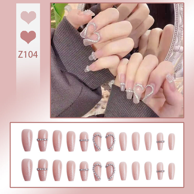 Glamorous artificial nails with heart and glitter design Stornfield