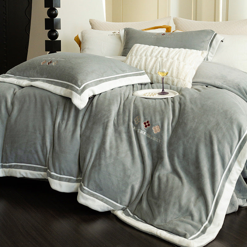 Velvety duvet cover set with embroidered floral design and contrasting piping