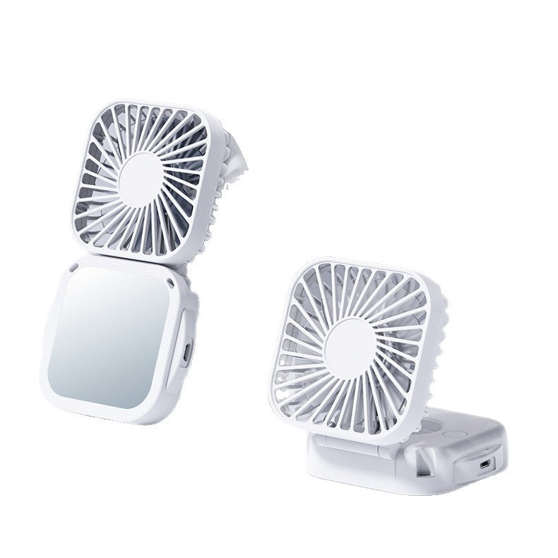 Unisex nan compact foldable clip on handheld desk fan with built in mirror adjustable tilt and USB rechargeable battery Stornfield
