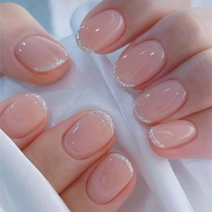 Acrylic nail set with elegant French tip and glitter accents Stornfield