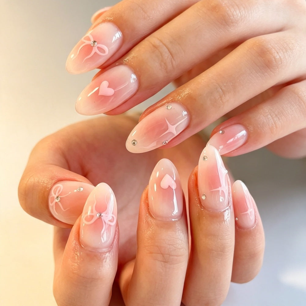 Artificial nails with romantic heart and bow design Stornfield