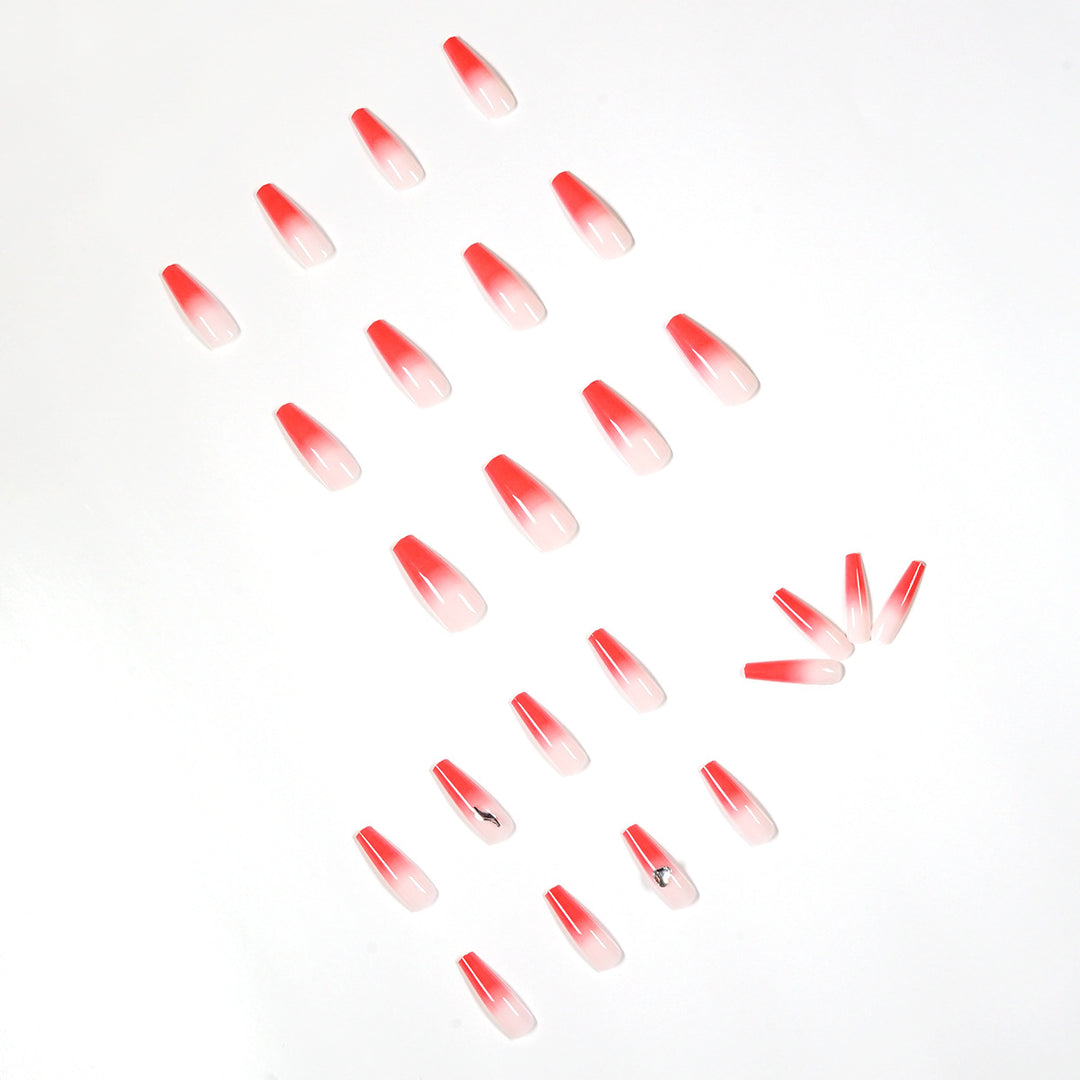 Artful stiletto nails with elegant gradient and rhinestone embellishment Stornfield