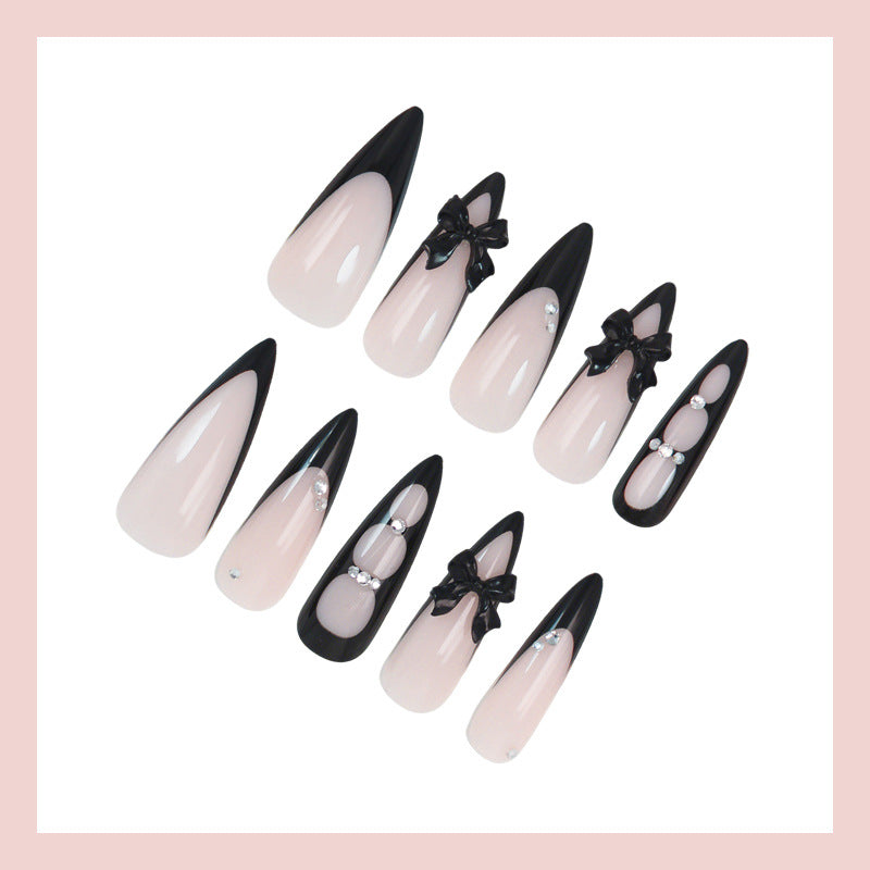 Acrylic nail set with shimmering accents and elegant bows Stornfield