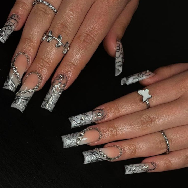 Artificial nails with elegant 3D pattern and radiant rhinestone decorations Stornfield