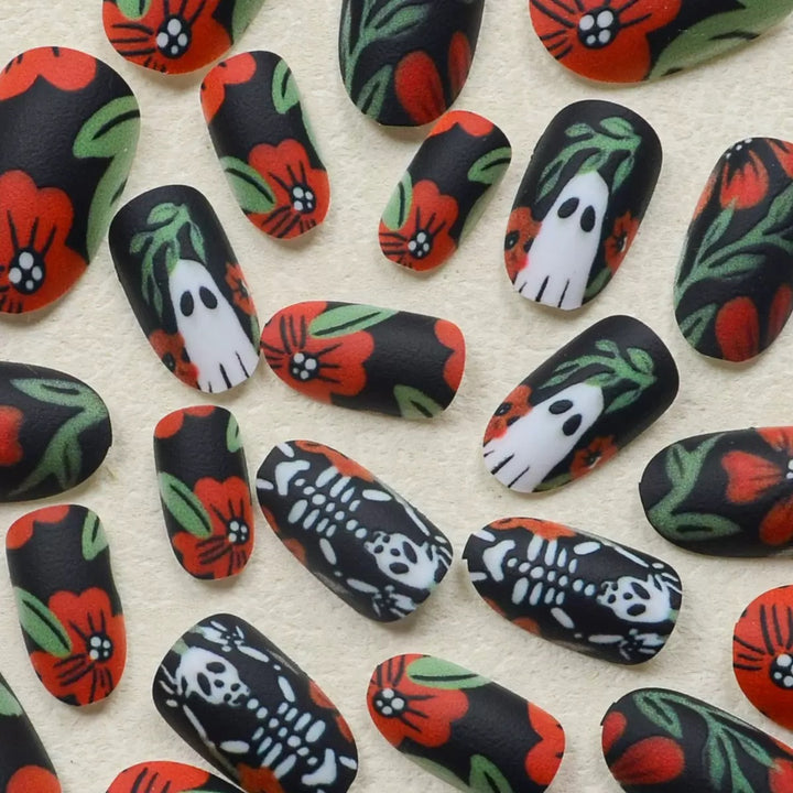 Acrylic nail set with creepy Halloween designs and floral accents Stornfield