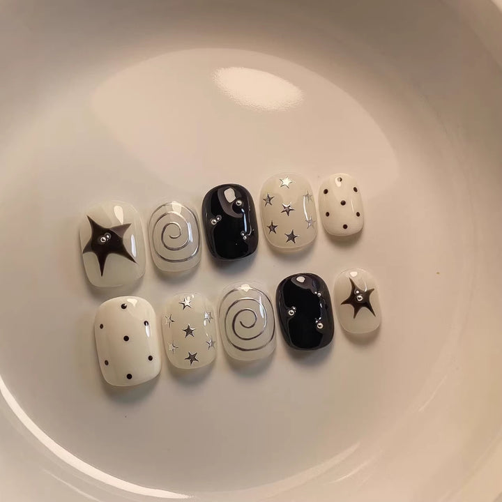 Artistic Press-On Nail Set with Star and Swirl Designs