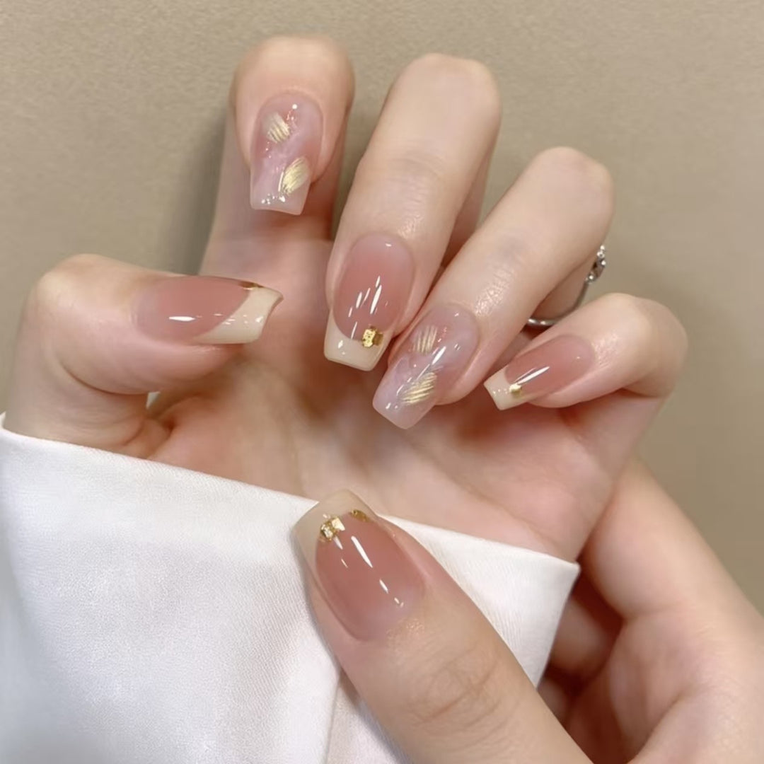 Elegant French Tip Nail Extensions with Gold Accents