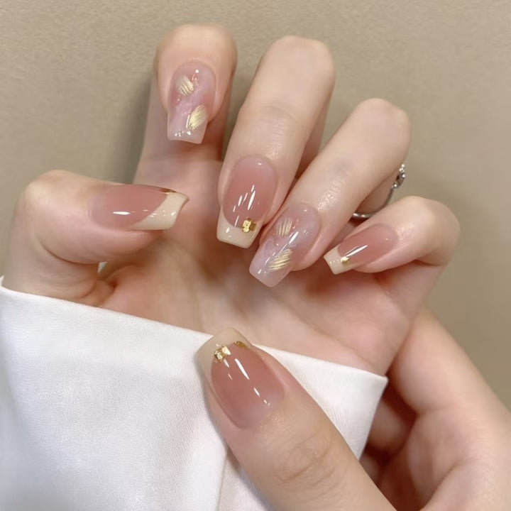 Elegant French Tip Nail Extensions with Gold Accents