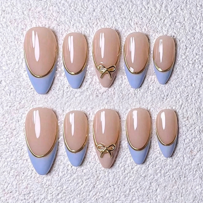 Acrylic nail set with elegant designs and gold accents Stornfield
