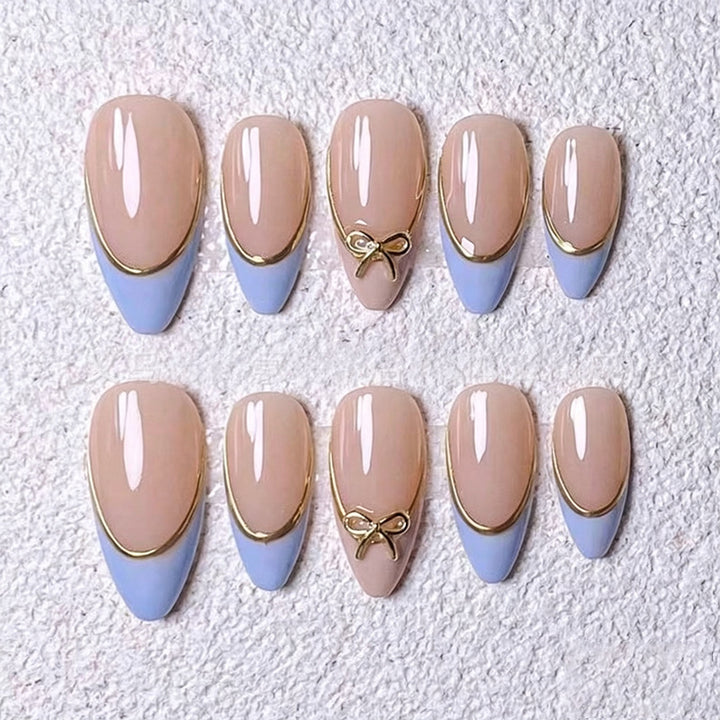 Acrylic nail set with elegant designs and gold accents Stornfield