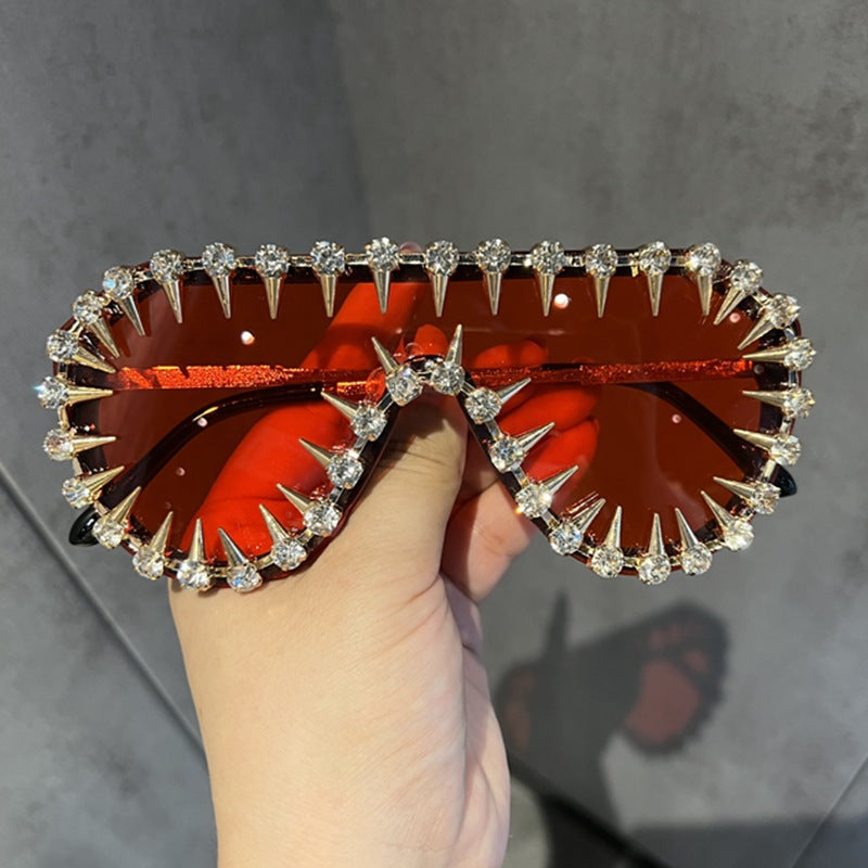 Ladies extravagantly designed cat-eye sunglasses with glitter accents Stornfield