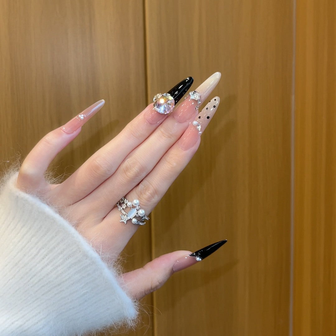 Elegant artificial nails with rhinestone and glitter elements Stornfield