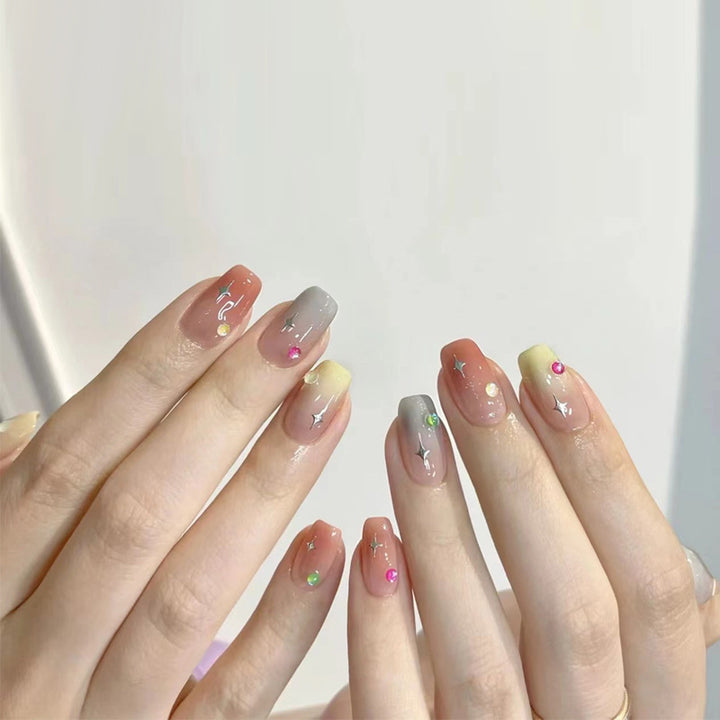Artificial nails with heart design and glamorous accents Stornfield