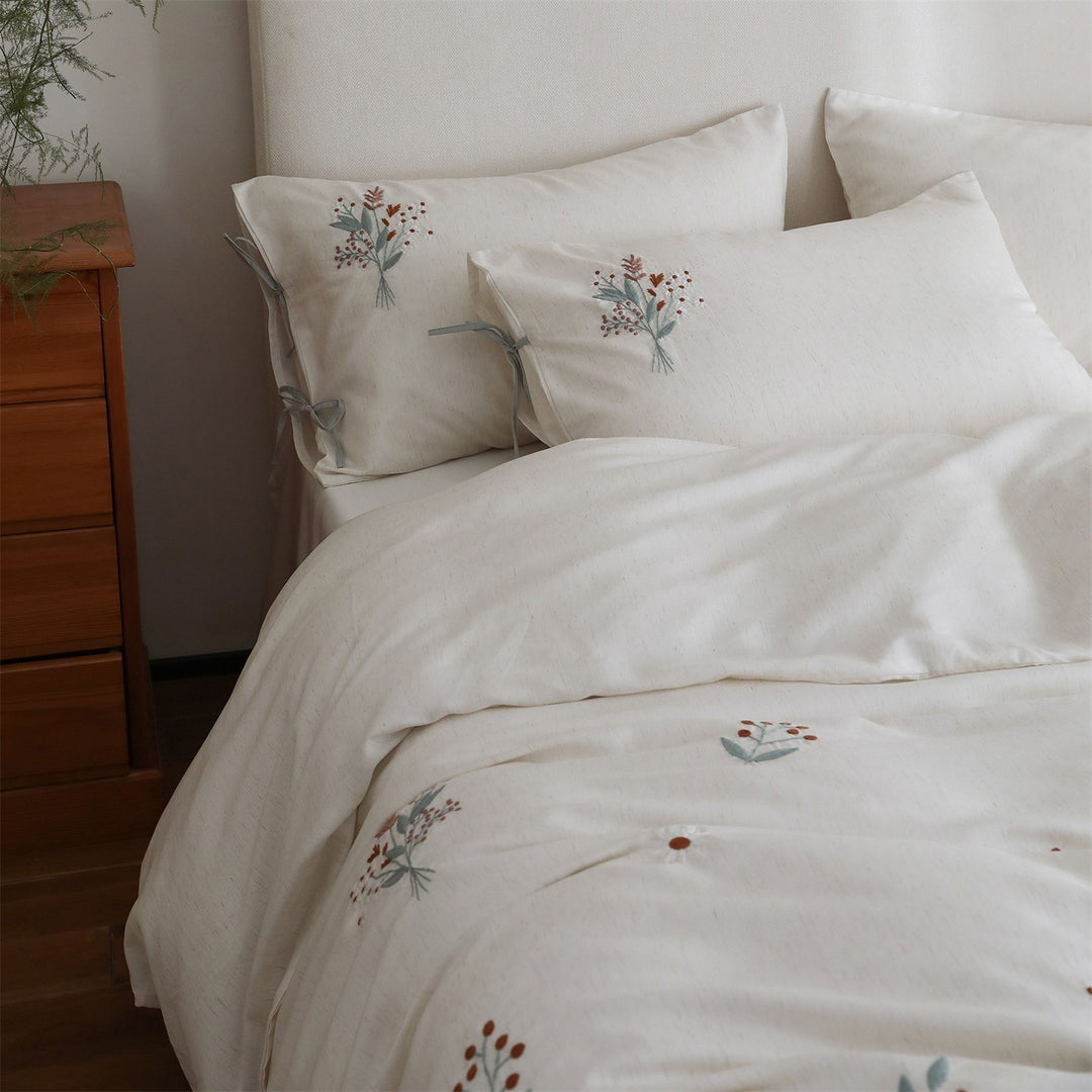 Embroidered cotton bedding set with bow pillowcases and dried flower embroidery