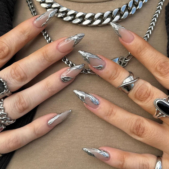 Artistic Acrylic Stiletto Nails with Elegant Metallic Decorations Stornfield
