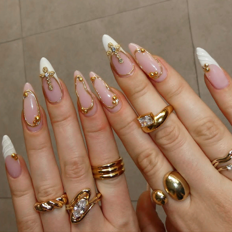 Artificial nail set with luxurious gold embellishments and elegant designs Stornfield