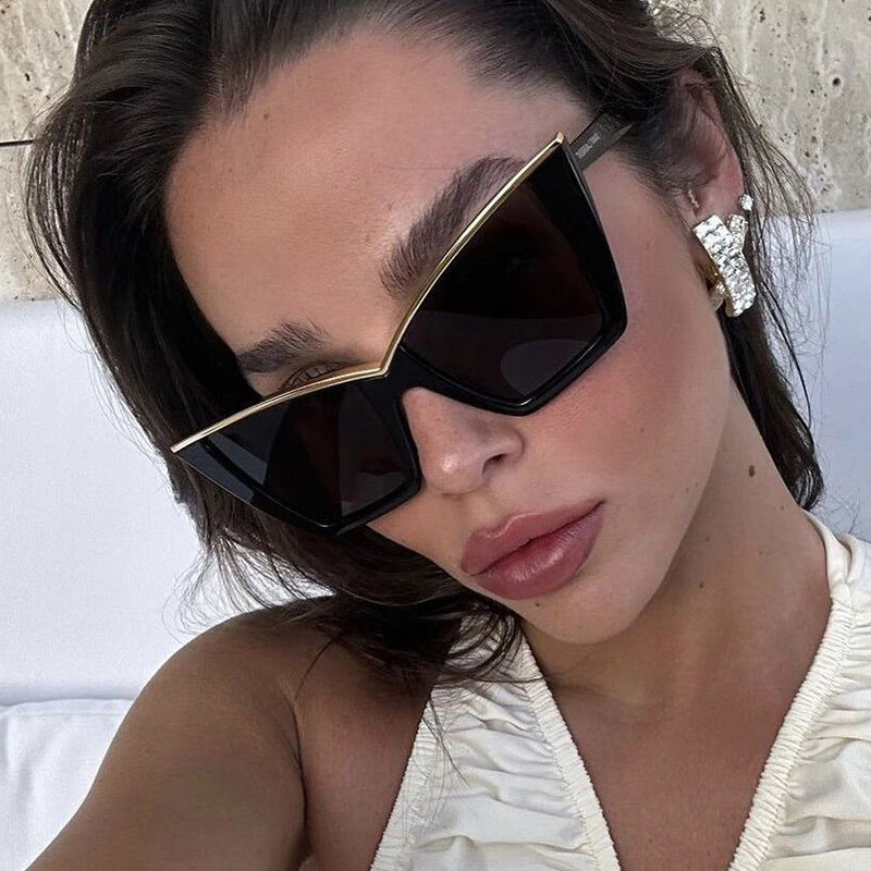 Women extravagant sunglasses with unique design and golden accents Stornfield