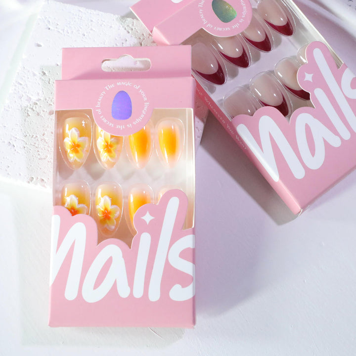 Artful nail extensions with delicate ombre effect and floral accents Stornfield