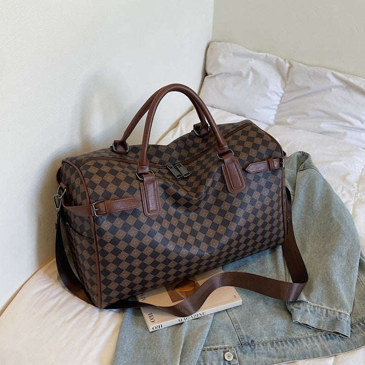 Sporty travel bag with multiple compartments and reinforced carrying handles Stornfield