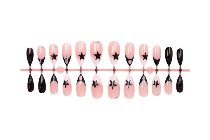 Acrylic nail set with creative star patterns and glitter accents Stornfield