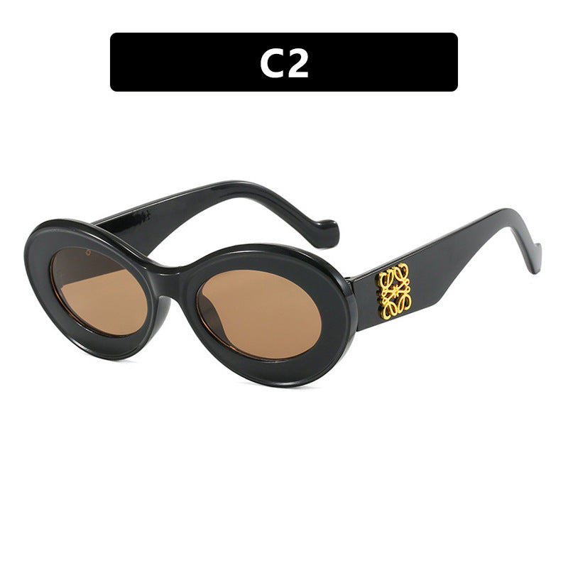 Women's fashionable sunglasses with oval frame and golden accents Stornfield