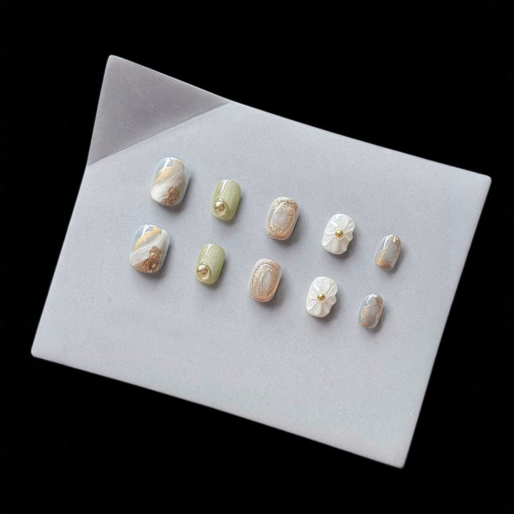 Premium Press-On Nail Art Set with Floral and Metallic Accents