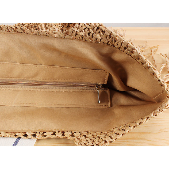 Designer straw bag with fringe decoration Stornfield