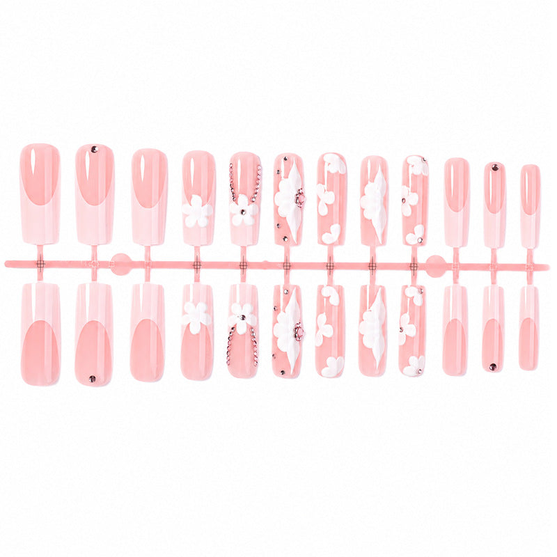 Artificial nail set with delicate flower and glitter details Stornfield