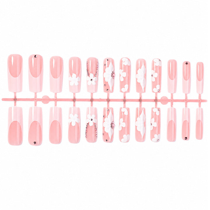 Artificial nail set with delicate flower and glitter details Stornfield