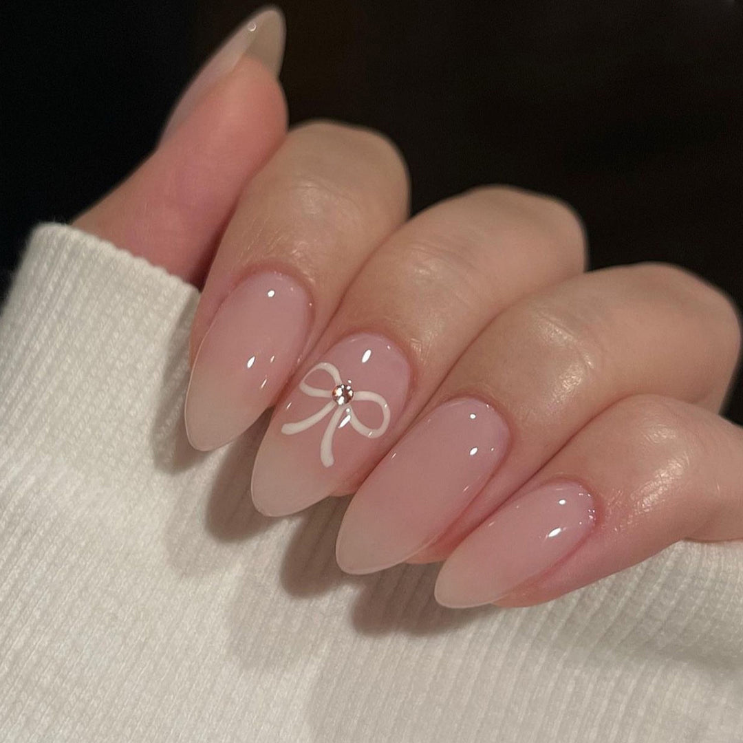 Artificia nails with delicate bow accents Stornfield