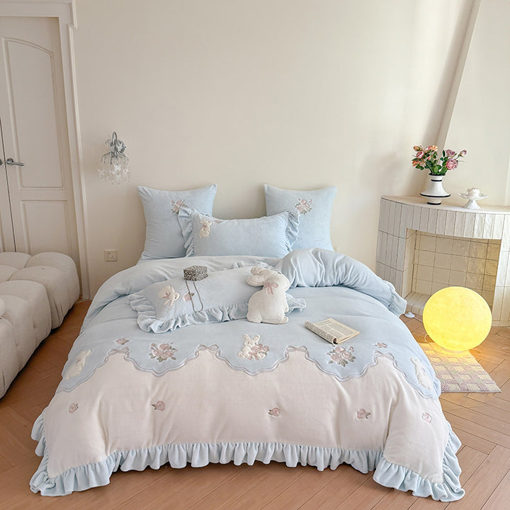 Luxurious bedding set with ruffles and floral embroidery