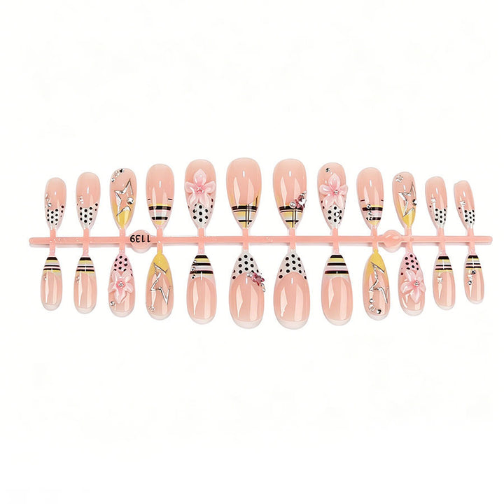 Artificial nail set with stylish floral accents and glitter details Stornfield