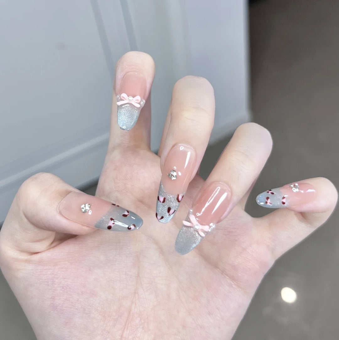 Artistic Press-On Nail Design with Floral and Gemstone Accents Stornfield