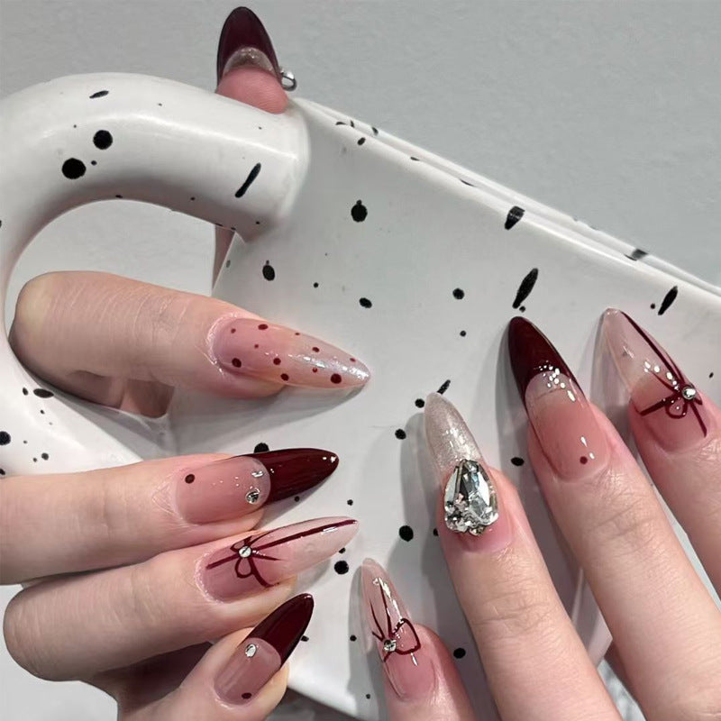 Artificial nail set with elegant bow and glitter details Stornfield