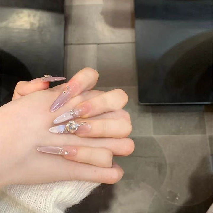 Artistic Stiletto Press-On Nail Art with Glimmering Accents Stornfield