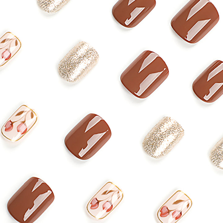 Artificial nail art with colorful flower design and glitter accents Stornfield